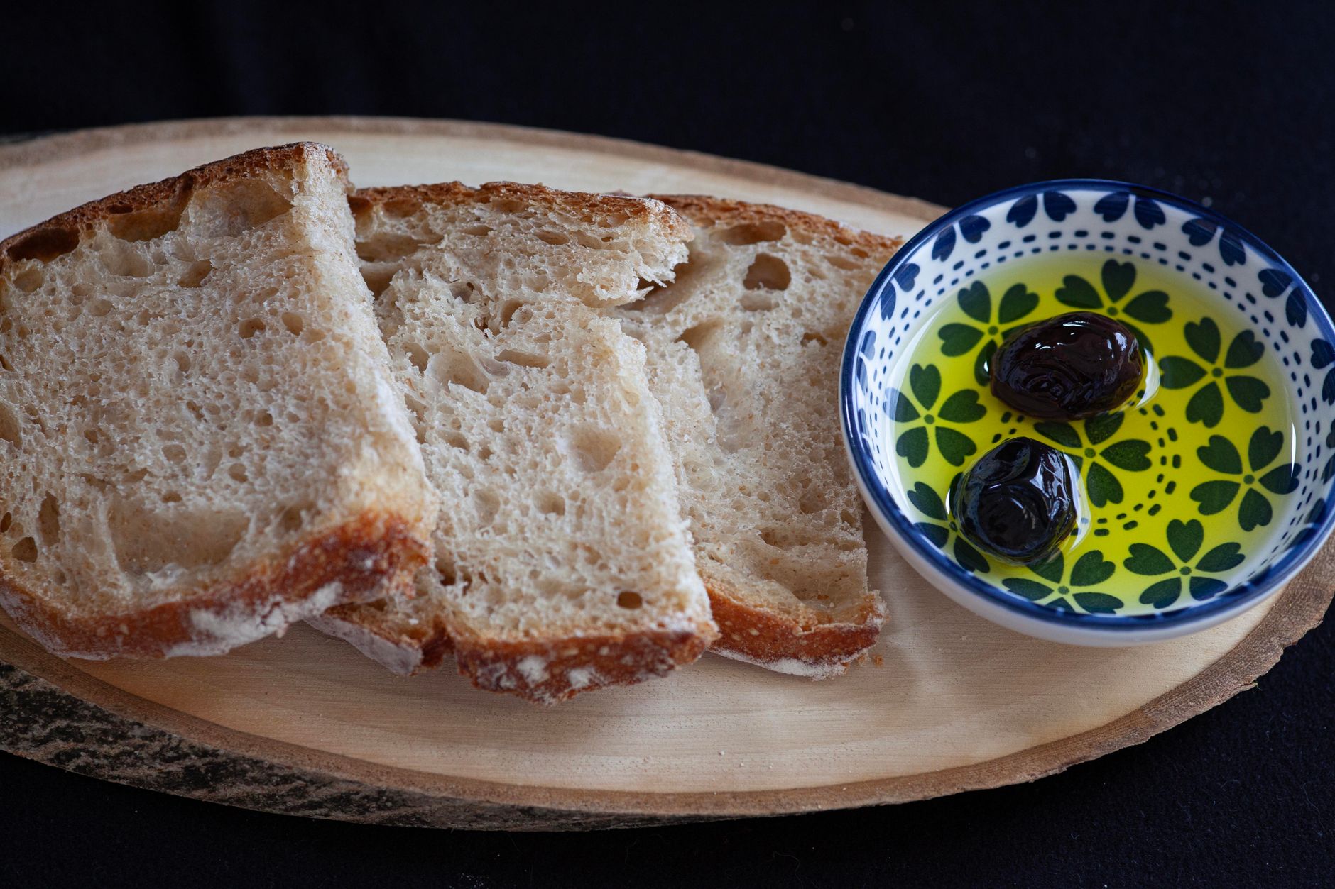 Rustic Mediterranean table with olive oil and bread